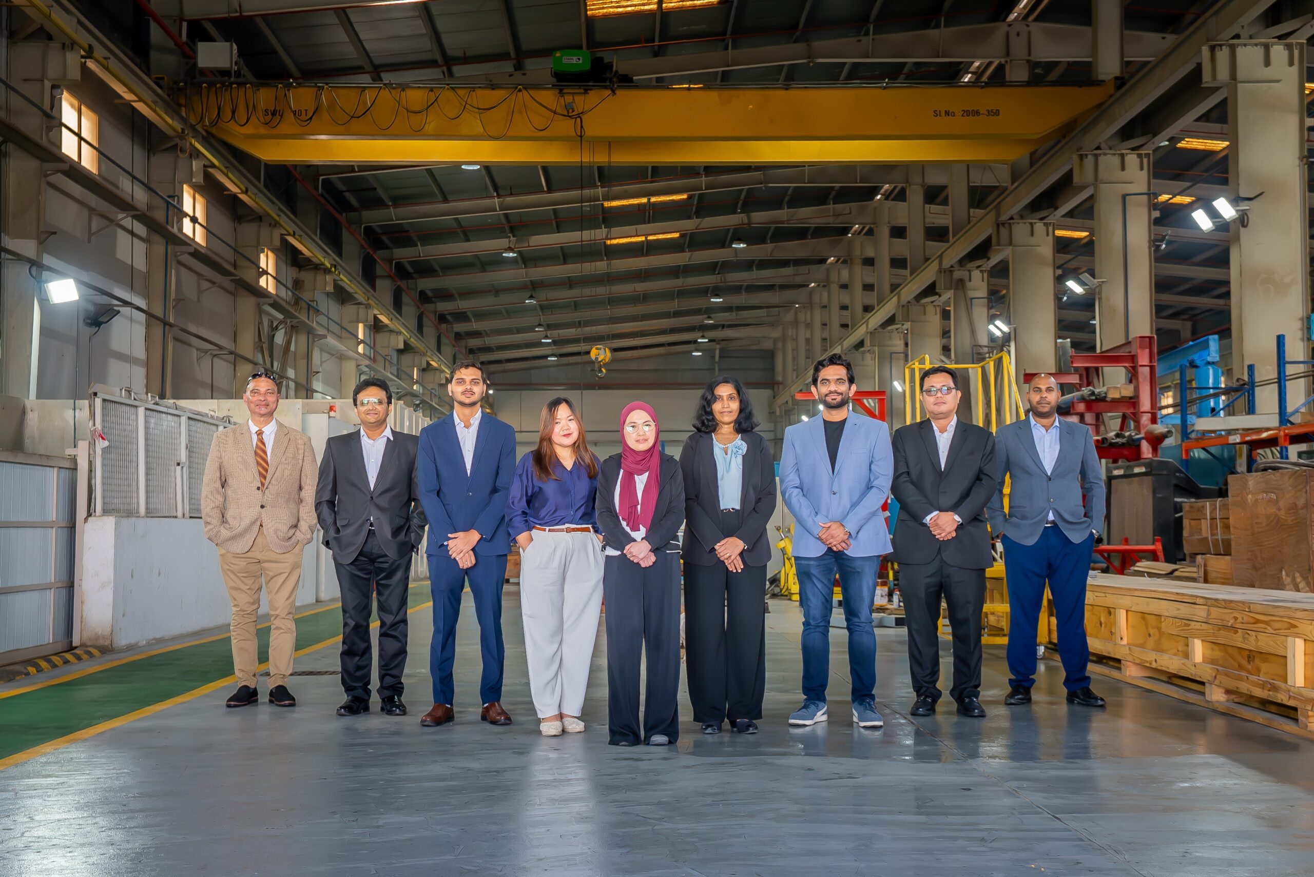 Group of professionals in industrial setting.